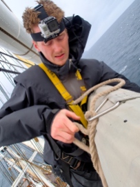 Wouter trying to untie the sail